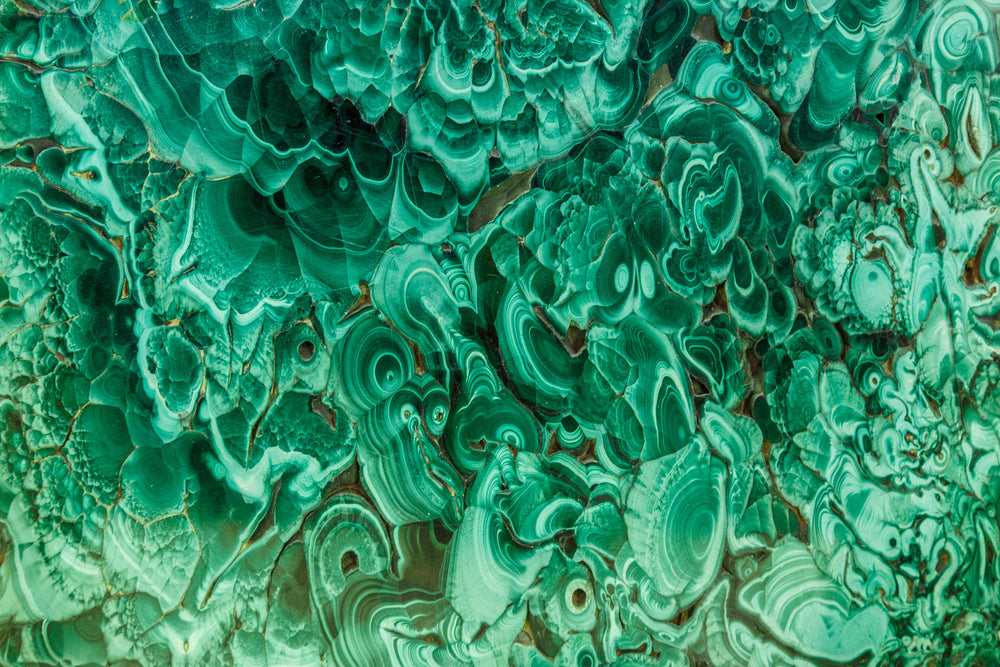 Malachite illuminating in light.