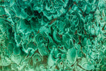 Malachite illuminating in light.
