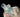 Raw aquamarine attached to a crystal.